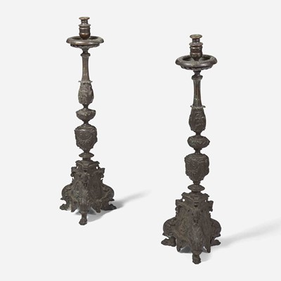 Lot 57 - A pair of Italian Baroque patinated bronze candlesticks