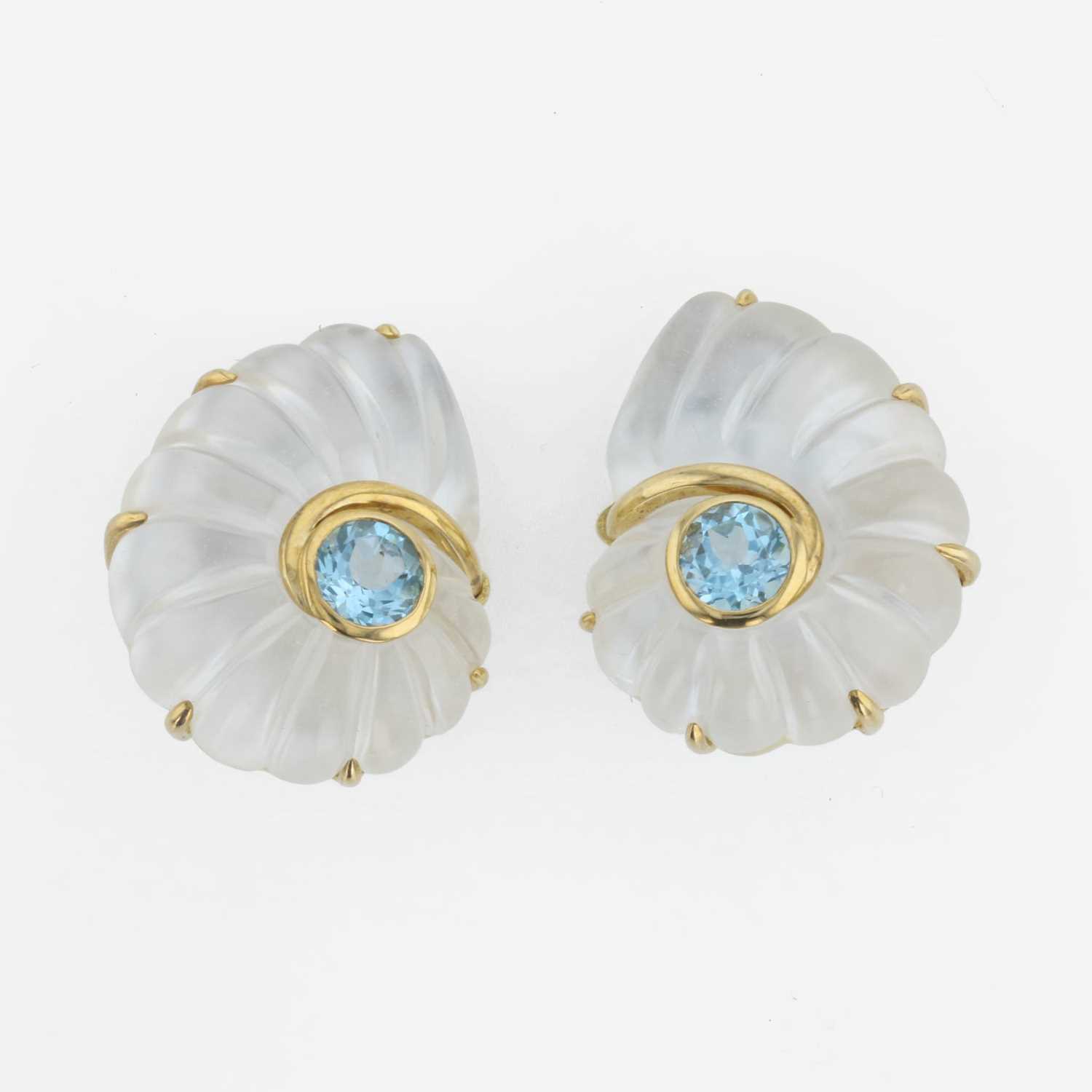 Lot 51 - A pair of 18K yellow gold, rock crystal, and blue topaz ear clips, Trianon