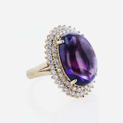 Lot 350 - An 18K Yellow Gold, Amethyst, and Diamond Ring