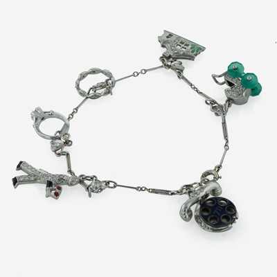 Lot 209 - An Art Deco Platinum and Diamond Charm Bracelet