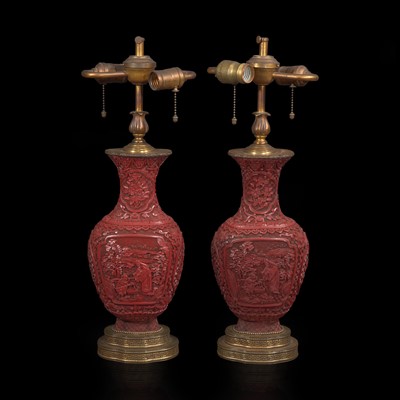 Lot 95 - A pair of Chinese carved cinnabar lacquer vases 朱漆花樽一对