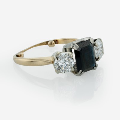 Lot 296 - A Three Stone Sapphire and Diamond Ring