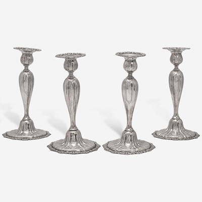 Lot 86 - A set of four sterling silver candlesticks