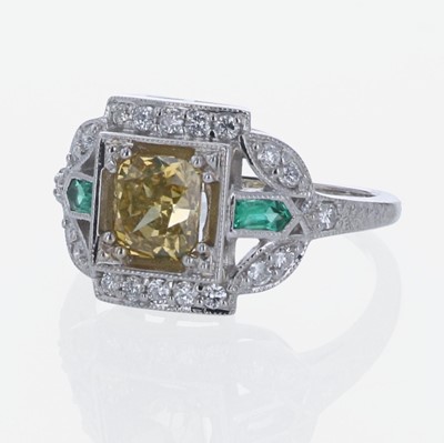 Lot 207 - A Colored Diamond, Diamond, Emerald, and 18K White Gold Ring