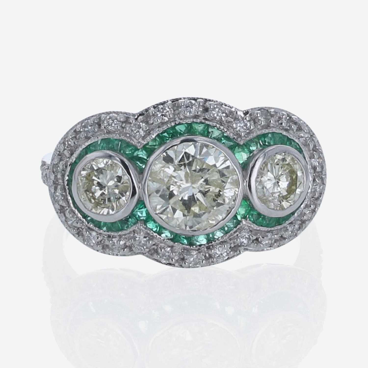Lot 205 - A Diamond, Emerald, and 18K White Gold Ring