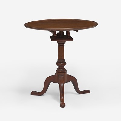 Lot 91 - A Chippendale carved walnut tilt-top tea table
