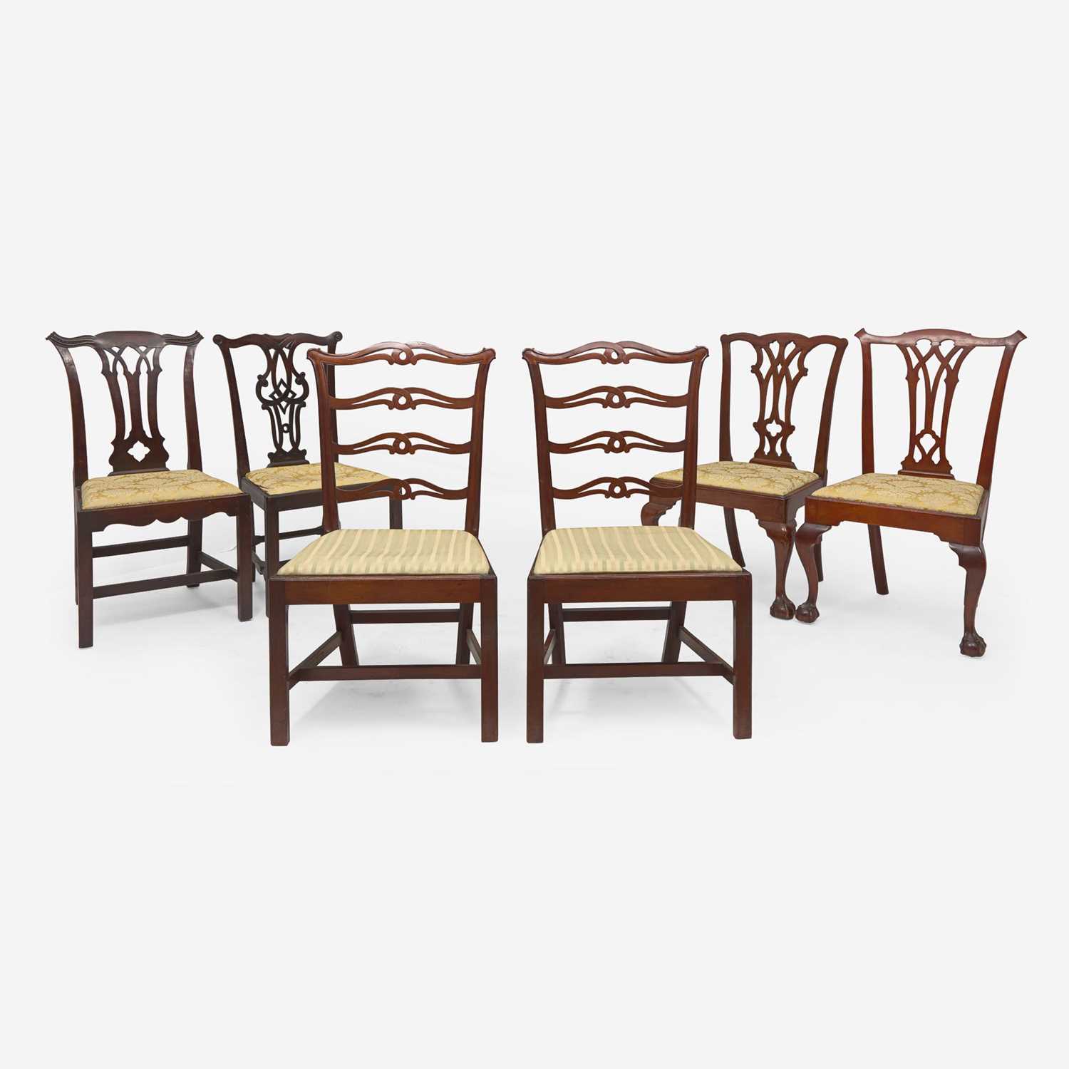 Lot 99 - An assembled group of six Chippendale carved mahogany and walnut side chairs