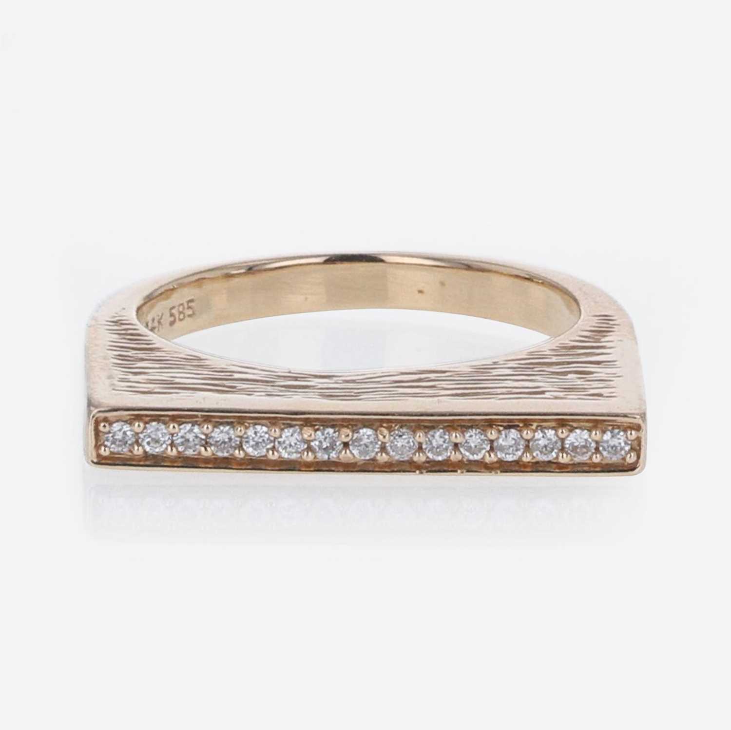 Lot 279 - A 14K Rose Gold and Diamond Ring