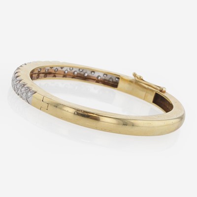 Lot 257 - An 18K Gold and Diamond Bangle Bracelet by Carl D. Lindstrom & Sons