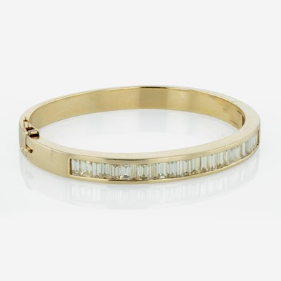Lot 260 - A 14K Yellow Gold and Diamond Bangle Bracelet