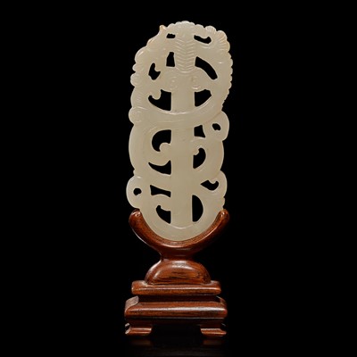 Lot 68 - A Chinese white jade "sword" pendant and wood stand 劍形玉飾
