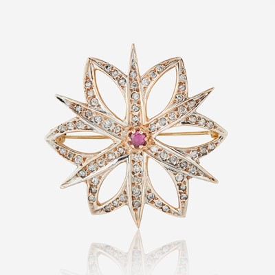 Lot 133 - A 10K Rose Gold, Diamond, and Ruby Brooch