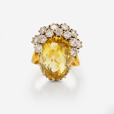 Lot 161 - An 18K Yellow Gold, Platinum, Diamond, and Yellow Sapphire Ring