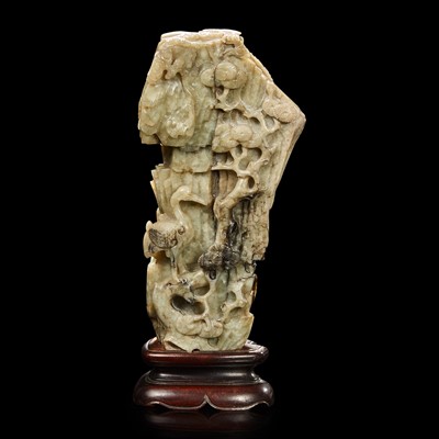 Lot 56 - A Chinese carved grey jade "mountain" 提油灰玉山子
