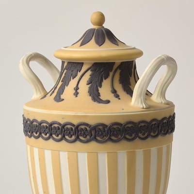 Lot 95 - A Wedgwood Buff Yellow Dip and Solid Black Jasperware Vase and Cover