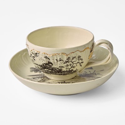 Lot 11 - A Wedgwood Queensware Shell Edge Cup and Saucer with Exotic Birds Decoration