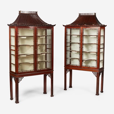 Lot 17 - A pair of Chinese Chippendale style carved mahogany and glass display cabinets