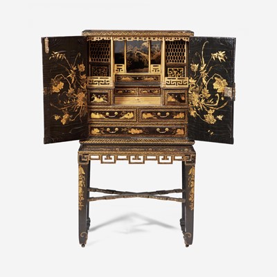 Lot 16 - A Chinese Export gilt-decorated black lacquer cabinet-on-stand