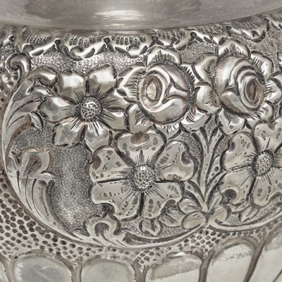 Lot 47 - A large sterling silver floral repoussé vase