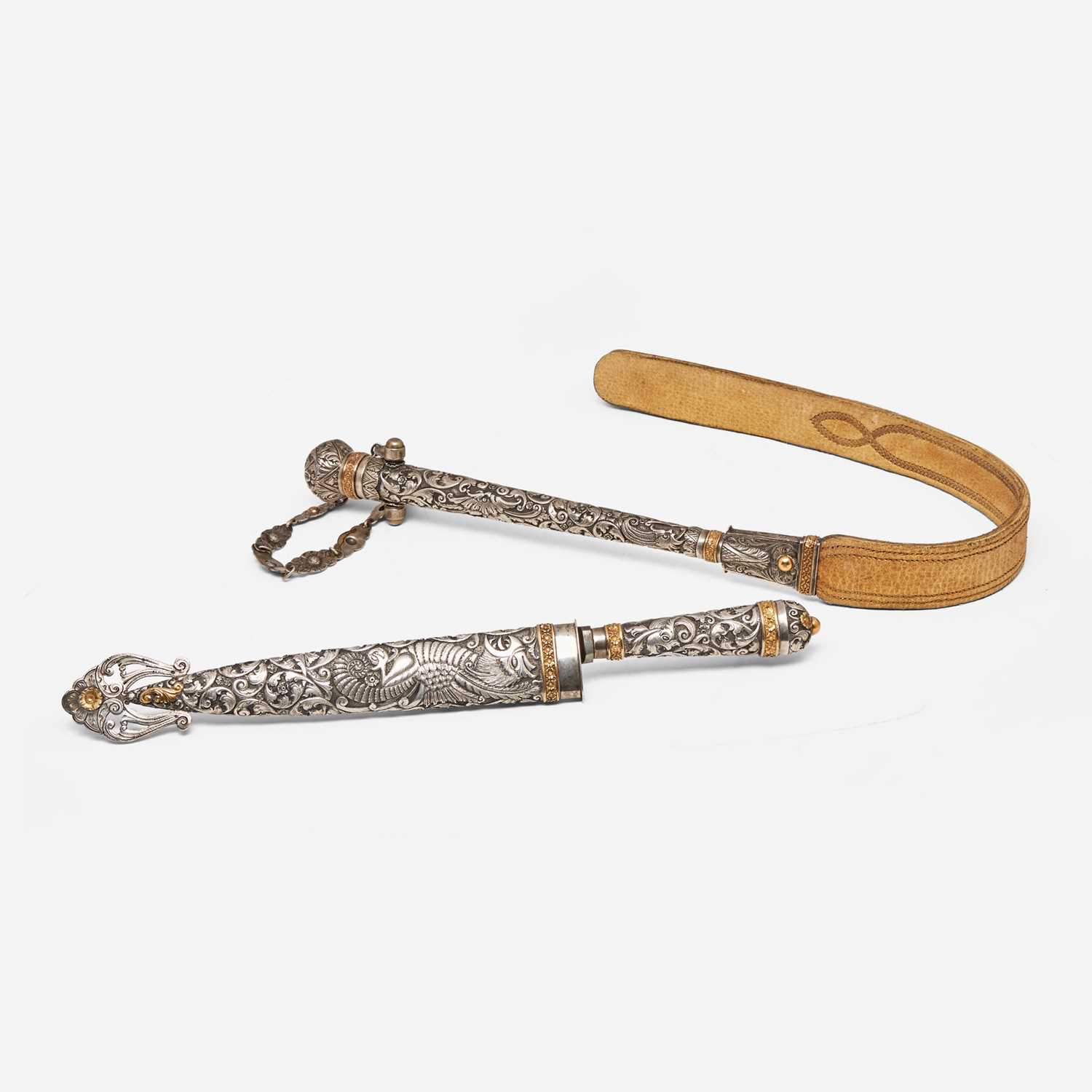 Lot 63 - A repoussé silver and gold gaucho knife and flogger