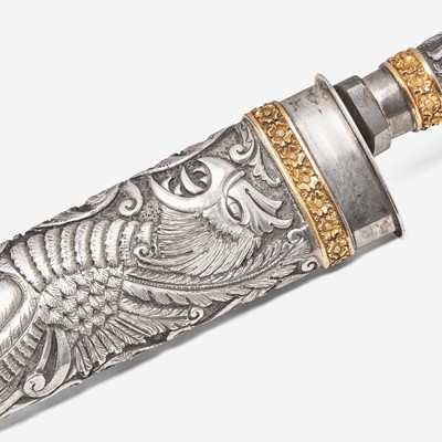 Lot 63 - A repoussé silver and gold gaucho knife and flogger