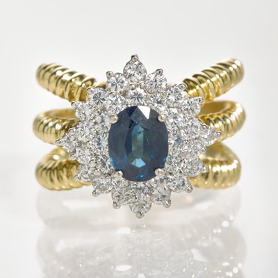 Lot 132 - An 18K Yellow Gold, Sapphire, and Diamond Ring
