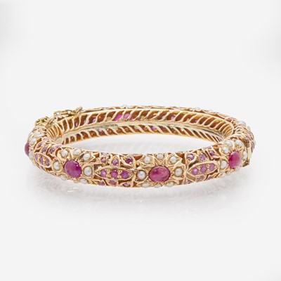 Lot 108 - A 14K Yellow Gold, Pearl, and Ruby Bracelet