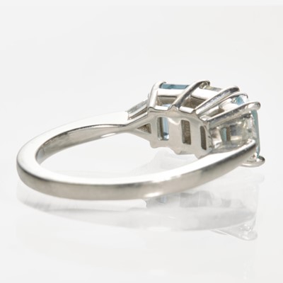 Lot 49 - A Platinum and Aquamarine Ring with Tiffany Diamond