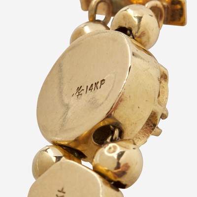 Lot 97 - A 14K Yellow Gold Slide Charm Bracelet