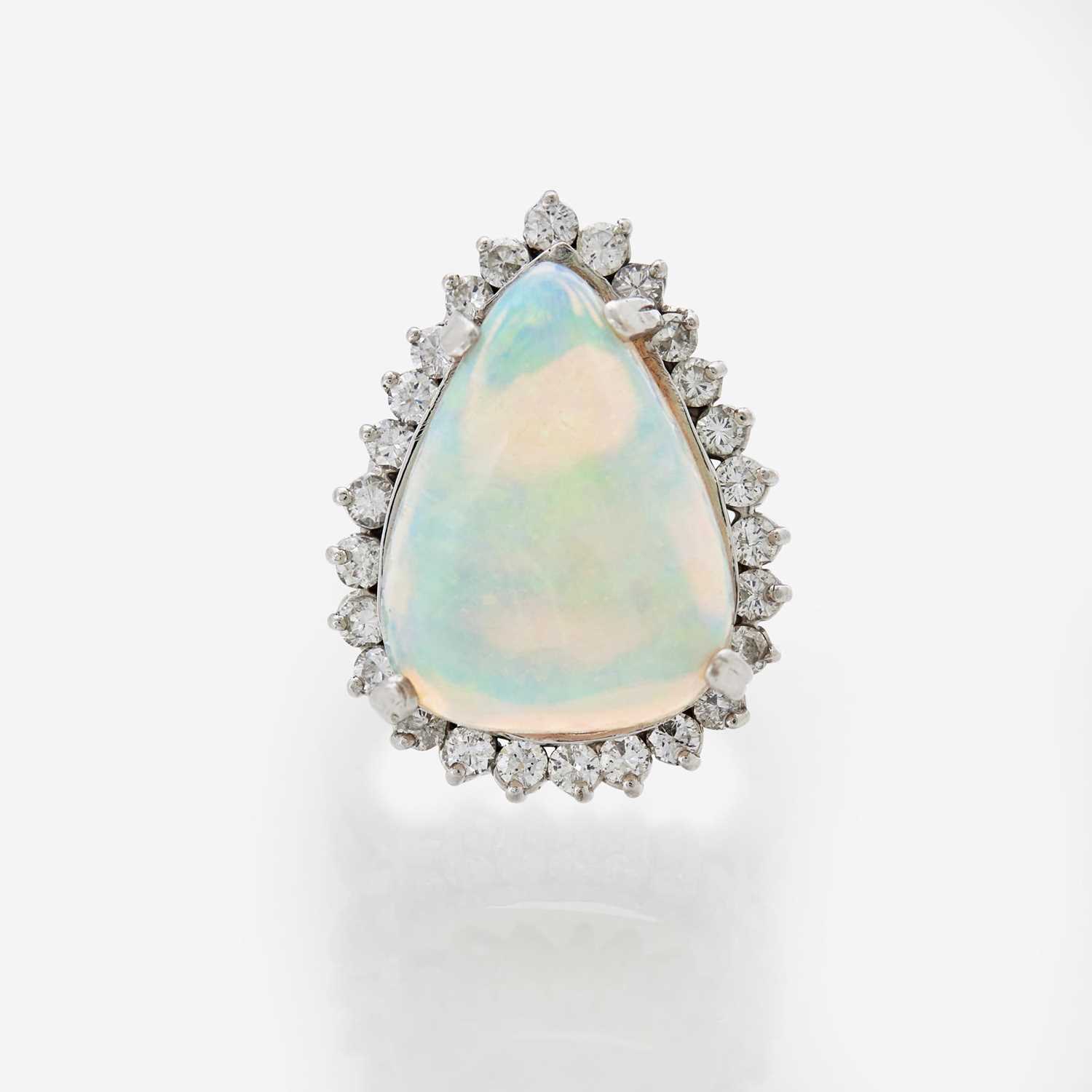 Lot 75 - A White Opal and Diamond Ring