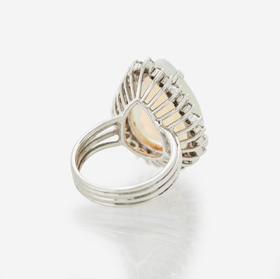 Lot 75 - A White Opal and Diamond Ring