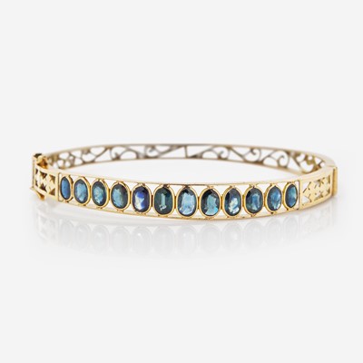 Lot 102 - A 14K Yellow Gold and Sapphire Bracelet