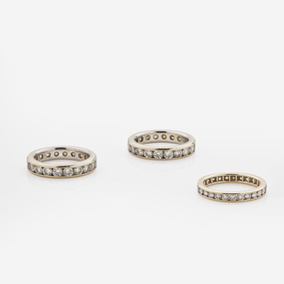Lot 153 - A Collection of Three 18K Gold and Diamond Bands