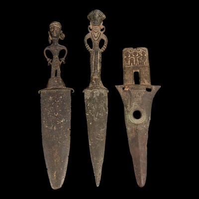 Lot 17 - Two Vietnamese bronze figural daggers and a halberd head 越南青銅匕首兩把及一戟首