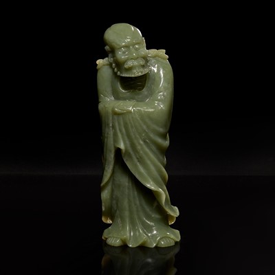 Lot 66 - A Chinese carved celadon jade figure of a Lohan 青玉雕羅漢