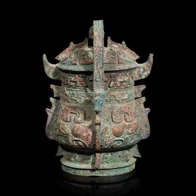 Lot 12 - A Chinese archaistic bronze covered ritual wine vessel, You 青銅提梁卣