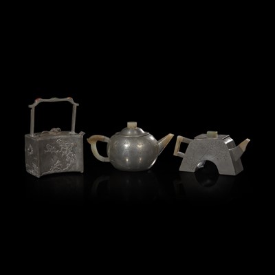 Lot 47 - A group of three Chinese jade-mounted pewter teapots 嵌玉錫包茶壺一組三把