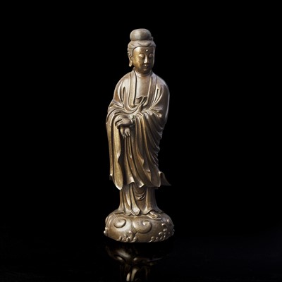 Lot 10 - A finely cast and patinated and silver-wire inlaid figure of Guanyin 漆銅嵌銀絲觀音造像