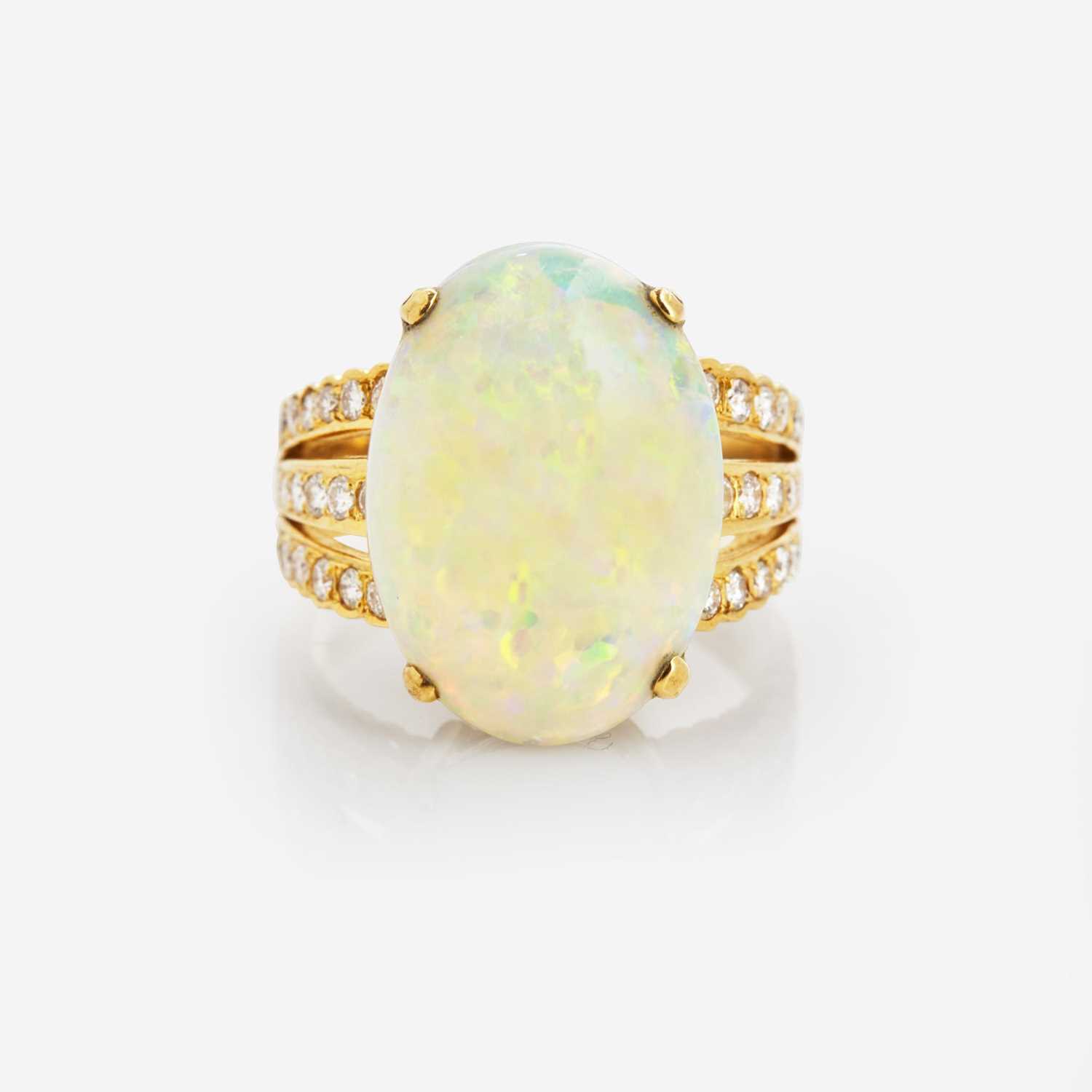 Lot 35 - An 18K Yellow Gold, Diamond, and Opal Ring