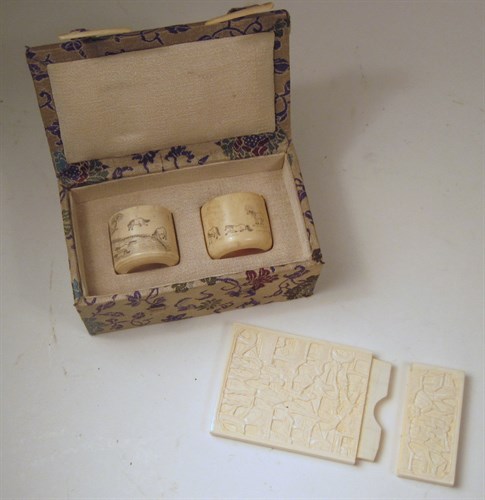 Lot 201 - Pair of Chinese elephant ivory archers' rings and a card case