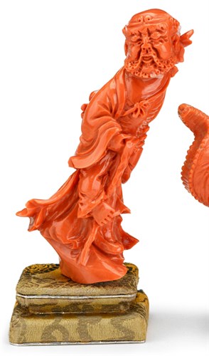 Lot 165 - Chinese carved coral figural of an immortal