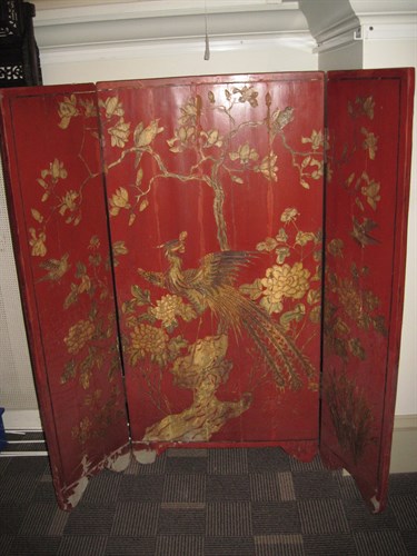 Lot 93 - A Chinese red and gilt lacquer floor screen