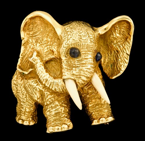 Lot 74 - 18 karat yellow gold, sapphire and ivory 'elephant' brooch, J.E. Caldwell & Co.
