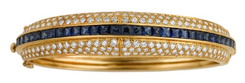 Lot 17 - 18 karat yellow gold sapphire and diamond bangle bracelet