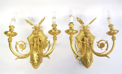 Lot 37 - Set of four Louis XVI style gilt bronze two-light sconces