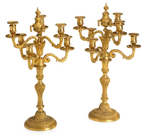 Lot 17 - Pair of Louis XVI style gilt bronze six-light candelabra