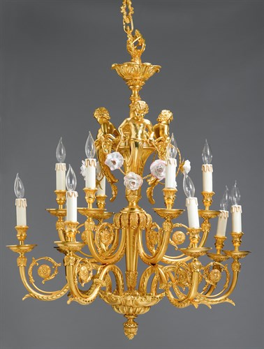 Lot 27 - Louis XVI style gilt bronze and porcelain mounted twelve-light chandelier