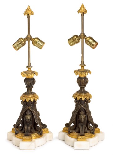 Lot 34 - Pair of Napoleon III gilt and patinated bronze candlesticks