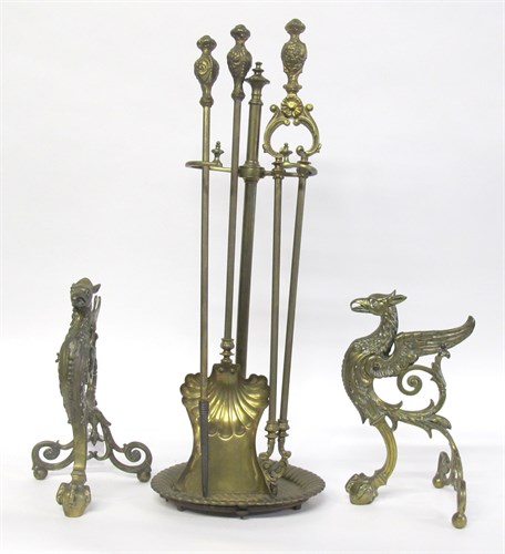 Lot 54 - Pair of English griffin form brass fire dogs