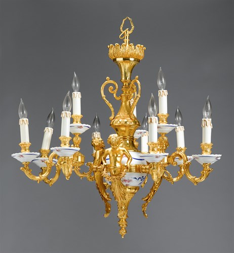 Lot 30 - Italian gilt bronze and porcelain twelve-light chandelier